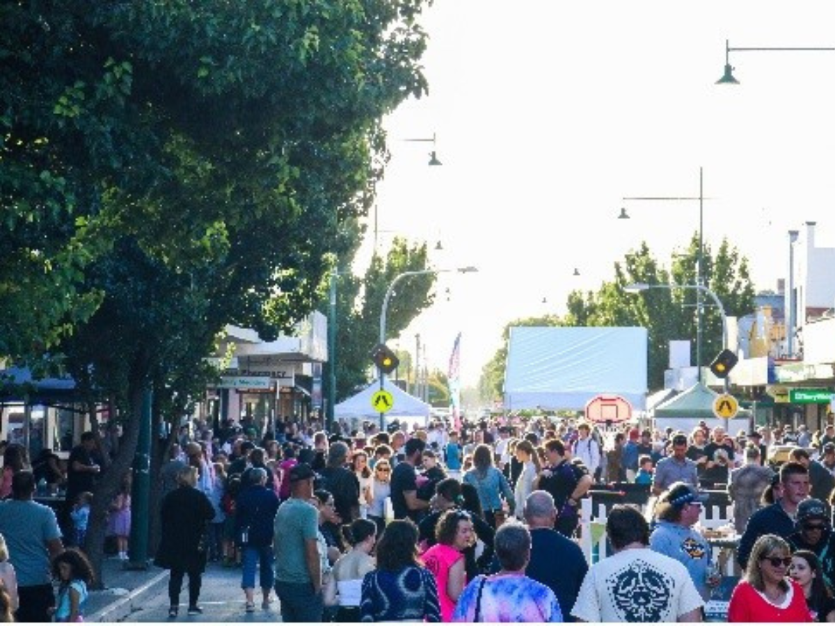 A crowd of people enjoy the Kyabram Tastes & Tunes street festival.