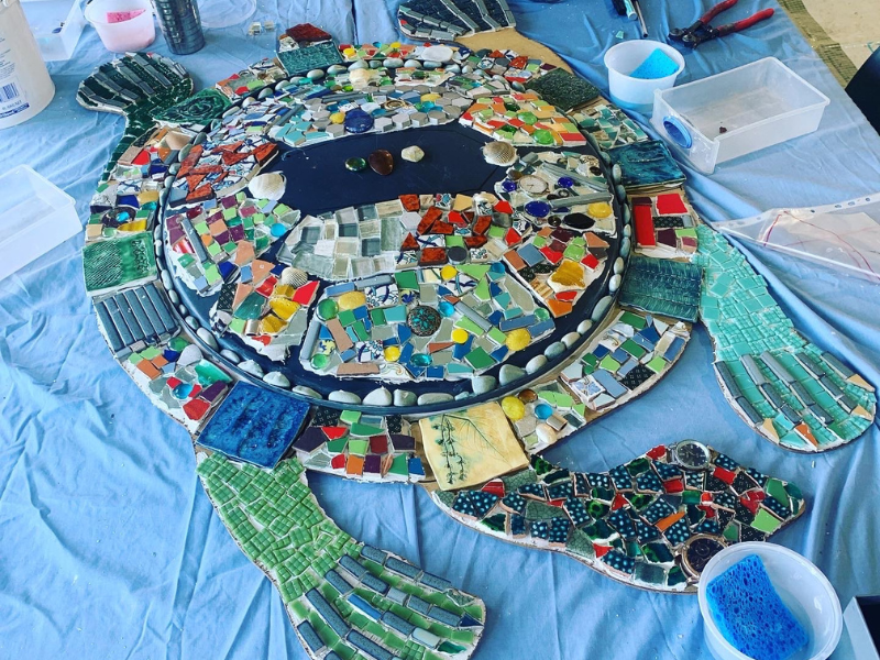 Colourful art project sits on a table.