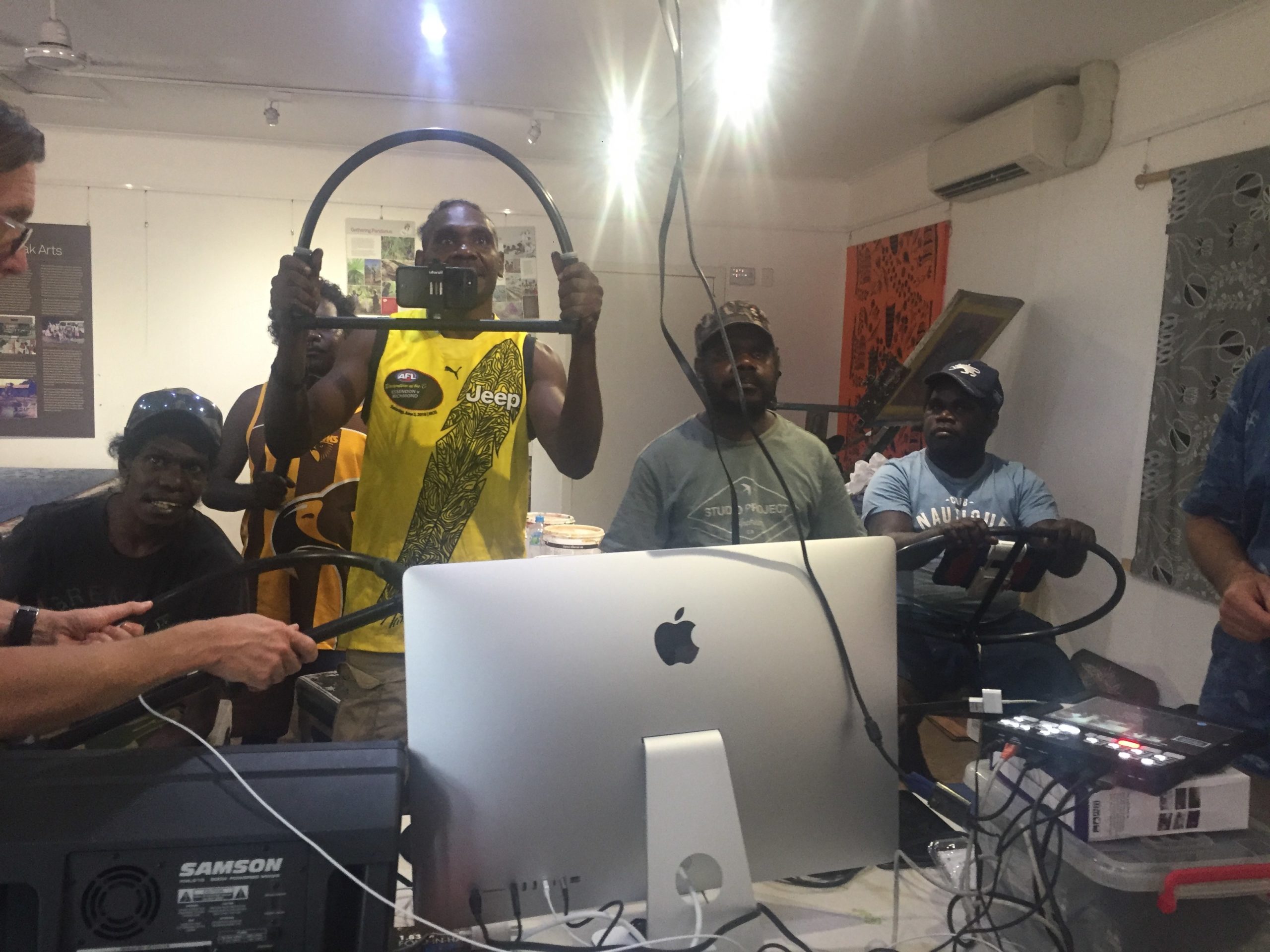 A group of men in a room with computer equipment