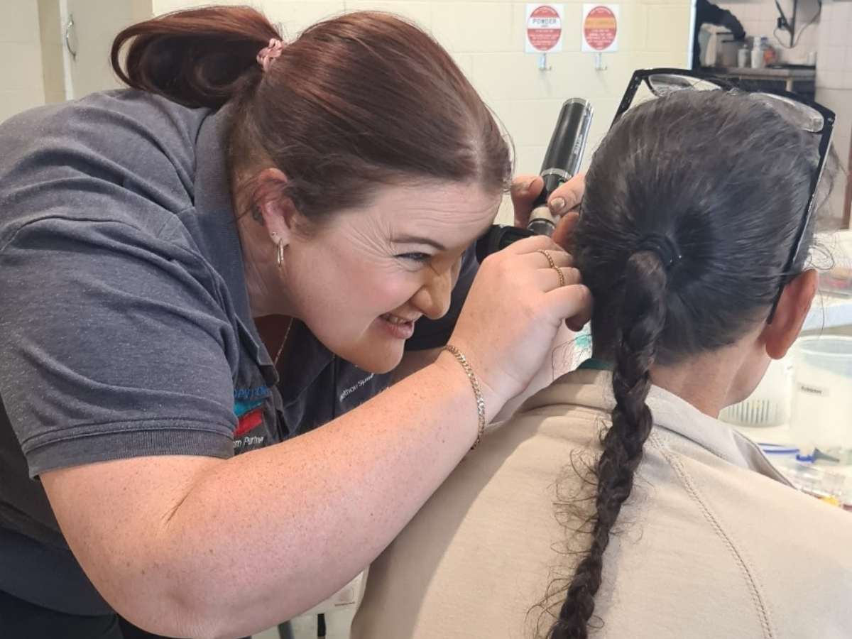 Audiologist conducting a hearing test.