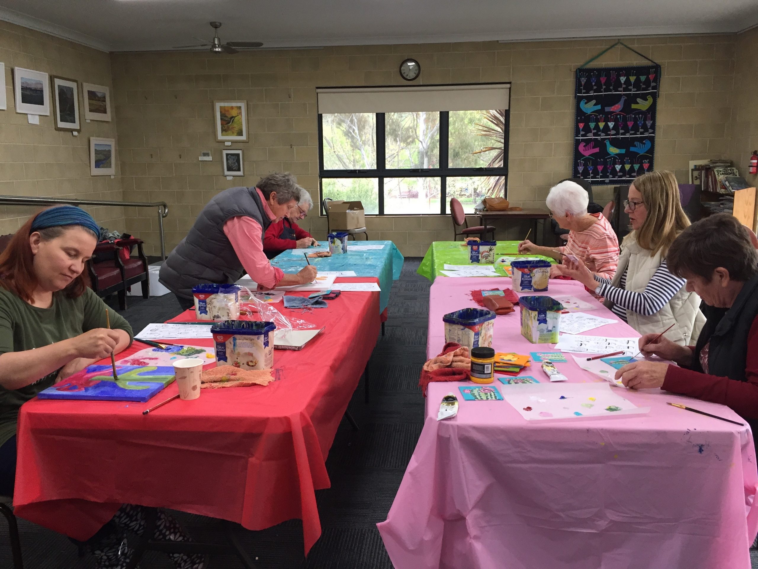 A group of people working on art projects
