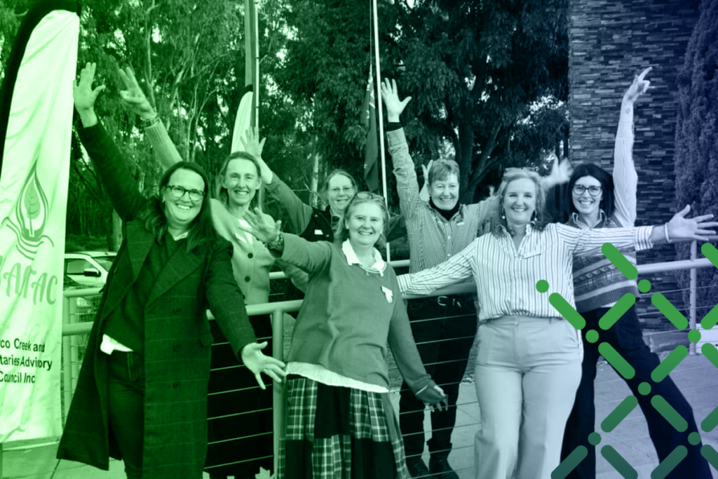 Women celebrating with their arms in the air.